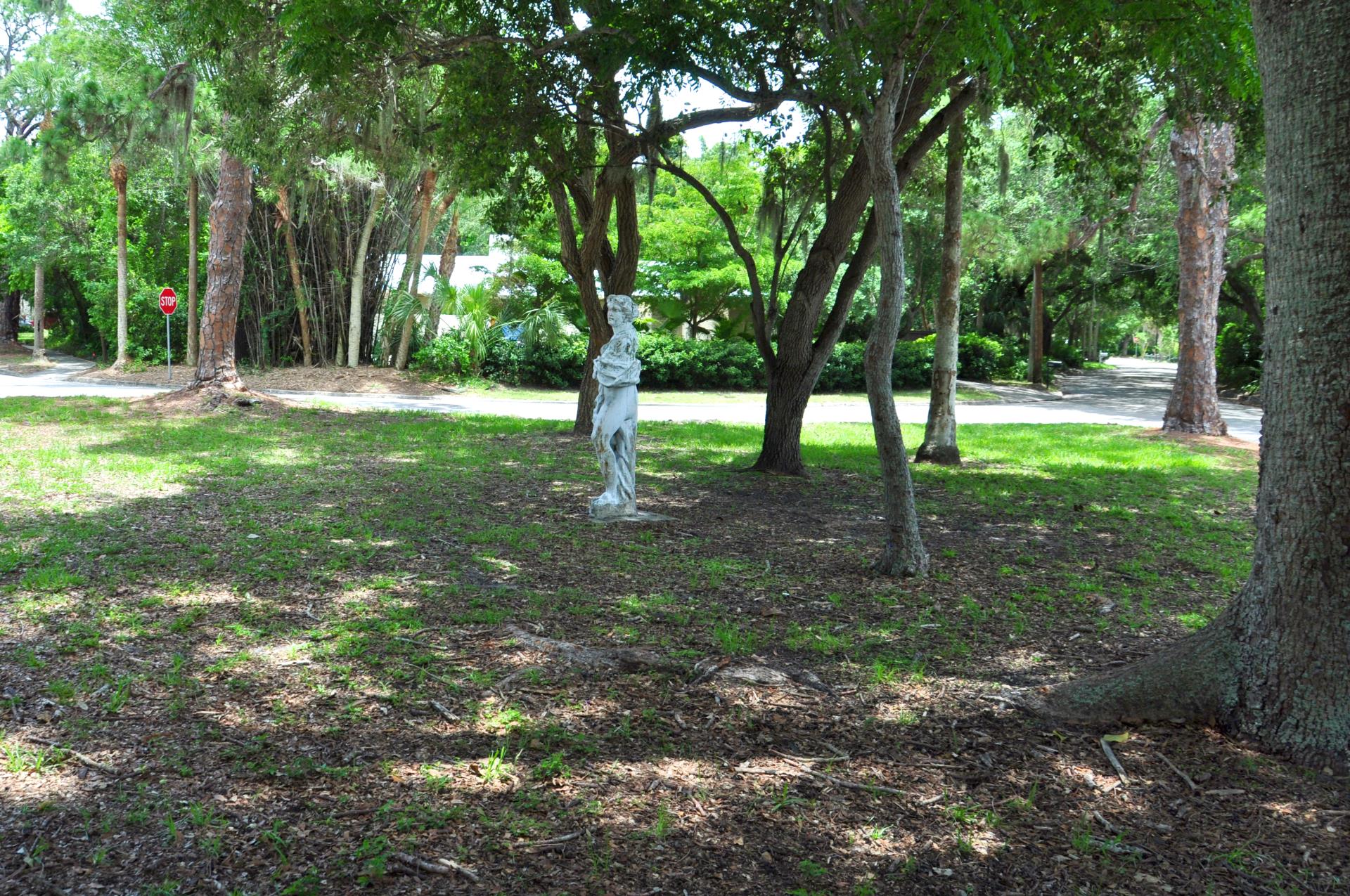 Open park with statue of woman draped