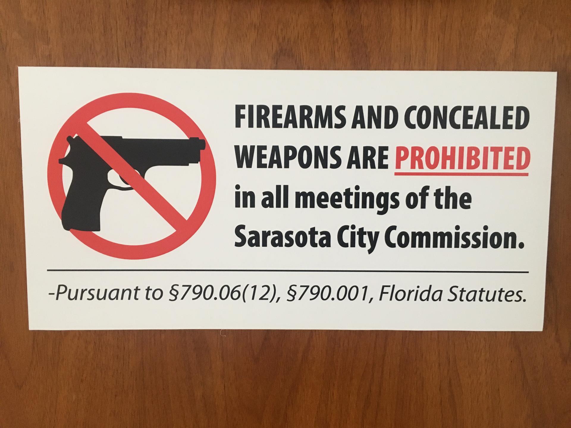 Sign prohibiting firearms at City Commission meetings, per Florida statutes.