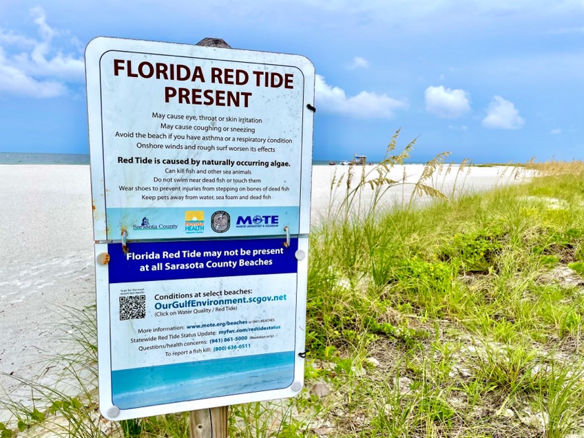 Red Tide Present sign